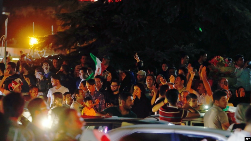 File photo:Iranians celebrate on the streets of Tehran early on June 13, 2017, after their national football team won the 2018 World Cup qualifying football match between Iran and Uzbekistan. (Photo by STRINGER / AFP)