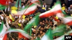 Basij militia wave Iranian flags