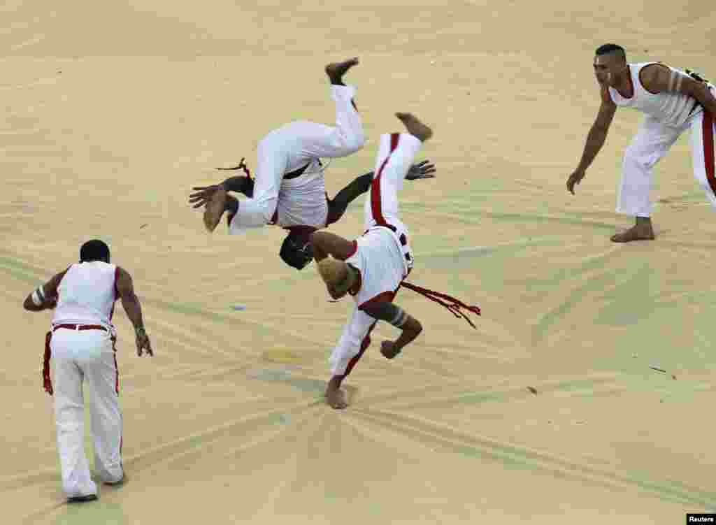 Dancers demonstrate the Brazilian martial art Capoeira during the opening ceremony.