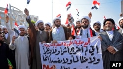 Member's of Najaf's Shiite clerical community and religious studies students calling for reform take part in anti-government protests in the central Iraqi holy city on October 29, 2019.