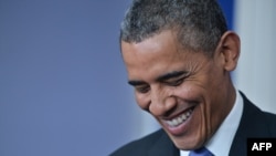 U.S. President Barack Obama enjoys a lighter moment during his end-of-year press conference at the White House on December 20.