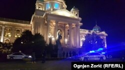 Police investigators attend the scene of the incident in front of Serbian parliament on January 23.