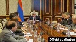 Armenian President Serzh Sarkisian met senior officials in Yerevan on June 27 before announcing his latest proposal to defuse protests sparked by planned utility rate hikes. 