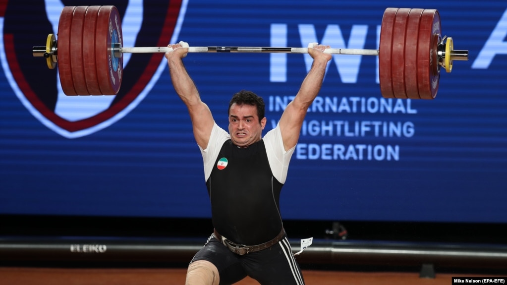 Sohrab Moradi from Iran sets a world record of 233 kilograms during the clean and jerk competition at the Weightlifting World Championships in Anaheim, California, on December 3. 