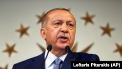 Turkey's President Recep Tayyip Erdogan delivers a statement on national television from his official residence in Istanbul on June 24.