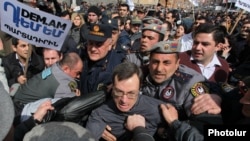 Armenia - Riot police clash with activists protesting against pension reform in Yerevan, 7Mar2014.