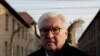 Germany's President Frank-Walter Steinmeier talks to journalists after laying a wreath at the Death Wall at the Auschwitz I Nazi death camp in Oswiecim, Poland, Monday, Jan. 27, 2020. 