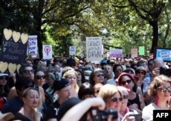 Women protesters march in a rally against U.S President Donald Trump following his inauguration, in Sydney on January 21.