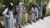 FILE: Former Taliban militants surrender their weapons during a reconciliation ceremony in the eastern Afghan city of Jalalabad.