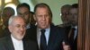 Russian Foreign Minister Sergei Lavrov (center) and Iranian Foreign Minister Mohammad Javad Zarif (left) enter a hall during their meeting in Moscow on April 28.