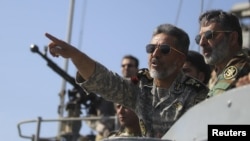 Iran -- Top naval commander, Admiral Habibollah Sayyari, points while standing on a naval ship during Velayat-90 war game on Sea of Oman near the Strait of Hormuz, 01Jan2012