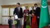  Turkmen President Gurbanguly Berdymukhammedov casts his vote at a polling station during the presidential election in Ashgabad on February 12.