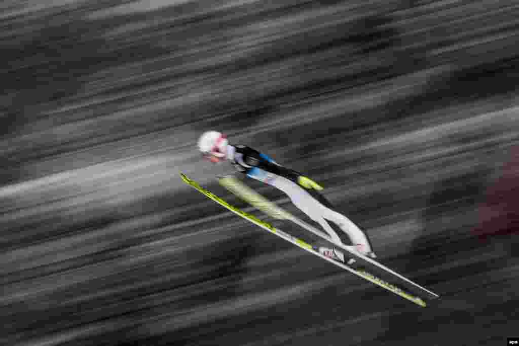 Ski jumper Evgeniy Klimov of Russia in action during a trial round of the fourth stage of the Four Hills Tournament at the FIS Ski Jumping World Cup event on the Paul Ausserleitner Hill in Bischofshofen, Austria. (epa/Christian Bruna)