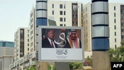 Saudi Arabia -- A giant billboard bearing portraits of US President Donald Trump and Saudi Arabia's King Salman, is seen on a main road in Riyadh, May 19, 2017
