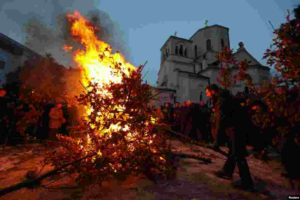 Serbs burn dried oak branches, which symbolizes the Yule log, on Orthodox Christmas Eve in front of the St. Sava temple in Belgrade on January 6. (Reuters/Marko Djurica)