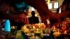 Women light candles in the Kenyan capital, Nairobi,on September 28 at the beginning of a 24-hour prayer vigil for victims of the Westgate mall massacre that left dozens dead. (AFP/ Carl de Souza)