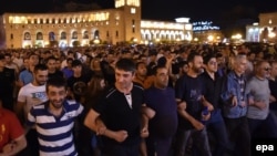Supporters of the opposition hold a protest march in support of the gunmen in Yerevan on July 26.