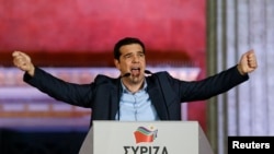 The head of the Syriza party, Alexis Tsipras, speaks to supporters in Athens after Greek parliamentary elections on January 25. 
