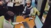 Dressed in an outfit vaguely reminiscent of Robocop, the former economy and trade minister glided through the flagship Sberbank branch in Moscow wearing special glasses, earmuffs, and body padding designed to impair his sight and hearing, and restrict his movement.