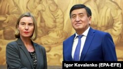 Kyrgyz President-elect Sooronbai Jeenbekov (right) meets EU foreign policy chief Federica Mogherini in Bishkek on November 9.