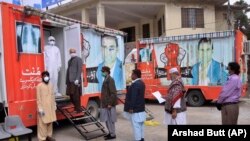 People wait for their turn to get free chest X-ray and other tests during a nation wide lockdown to help avoid the spread of the coronavirus in the northwestern city of Quetta on April 24.