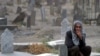 A man at Kabul's graveyard for Afghan "martyrs" in the fight against Soviet troops in September 2006