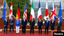 G7 leaders in Sicily: European Council President Donald Tusk (left) and European Commission President Jean-Claude Juncker (far right) pose with the G7 country leaders on May 26.