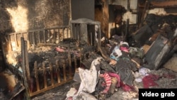 Последствия пожара во времянке в микрорайоне Коктал-1, в результате которого погибли пятеро детей. Астана, 4 февраля 2019 года.
