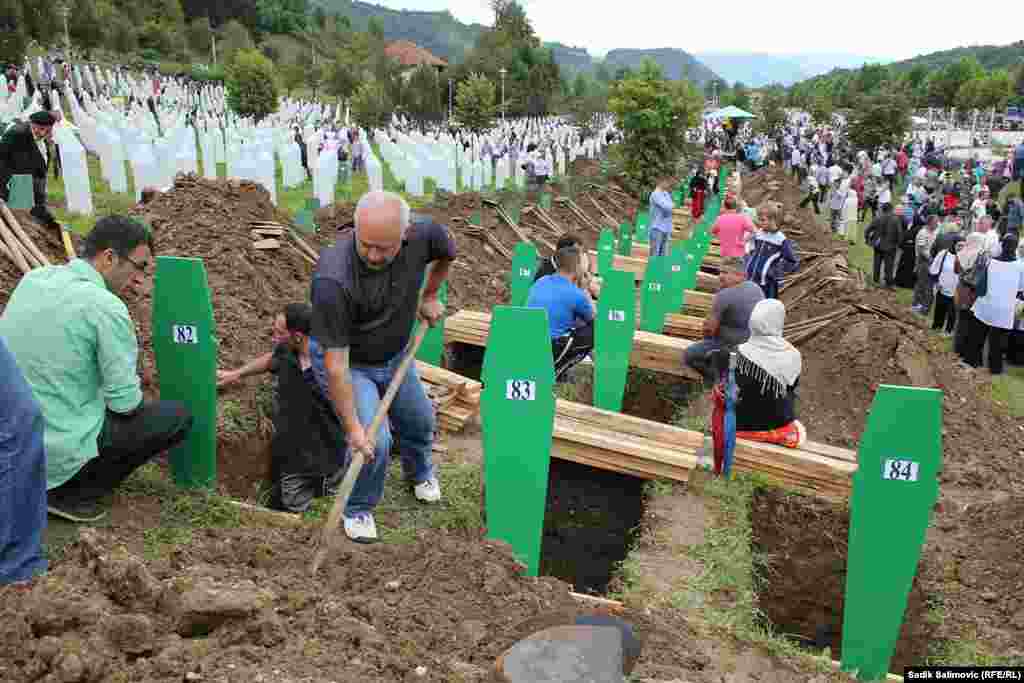 Graves are dug for the reburials.
