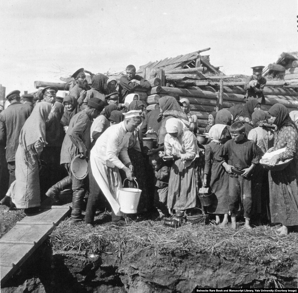 Villagers photographed during a trip made by the tsar and his family. The picture is one of only a few in the albums which focus on the ordinary people of Russia.&nbsp;