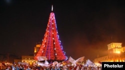 Armenia -- Children dance during the unveiling of a Christmas tree in Yerevan's central Republic Square, 25 December, 2009.