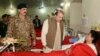 Pakistani Prime Minister Nawaz Sharif (C) and army chief General Raheel Sharif (L) visiting a school student injured in a terrorist attack (file photo).