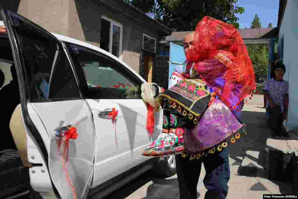 Another&nbsp;tradition -- a relative of the bride from the mother&#39;s side takes the bride out of the house and takes her to the car.