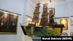 Still reeling from social protests, Iran showed off a gold-covered, Koran-inscribed ship bound for a shrine in neighboring Iraq.