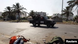 Unidentified bodies just outside the south gate of the Bab al-Aziziya compound as rebels make a final push to flush out pro-Qaddafi forces on August 24.