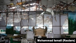 The damaged wedding hall where a suicide bomber struck on August 17, killing dozens of people.