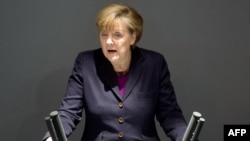 Канцлер ФРГ Ангела Меркель выступает перед бундестагом. Берлин, 20 марта 2014 года.