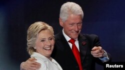 Former U.S. President Bill Clinton with his wife, Hillary, during the campaign