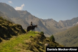 A rider with her Kabardian gelding Mashuk in the Austrian Alps in 2013