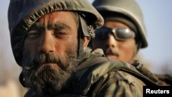 A dust-covered Afghan National Army soldier during a patrol near the Taliban stronghold of Panjwaii in Kandahar Province. (file photo)