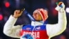 Russian gold medalist Aleksandr Legkov celebrates as he receives his medal for the men's cross-country 50-kilometer mass start race during the closing ceremony for the Sochi 2014 Winter Olympics in February 2014.