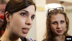 Nadezhhda Tolokonnikova (left) and Maria Alyokhina were convicted of hooliganism and sentenced to two years in jail in 2012 after staging a performance against Russian President Vladimir Putin in Moscow's Cathedral of Christ the Savior.