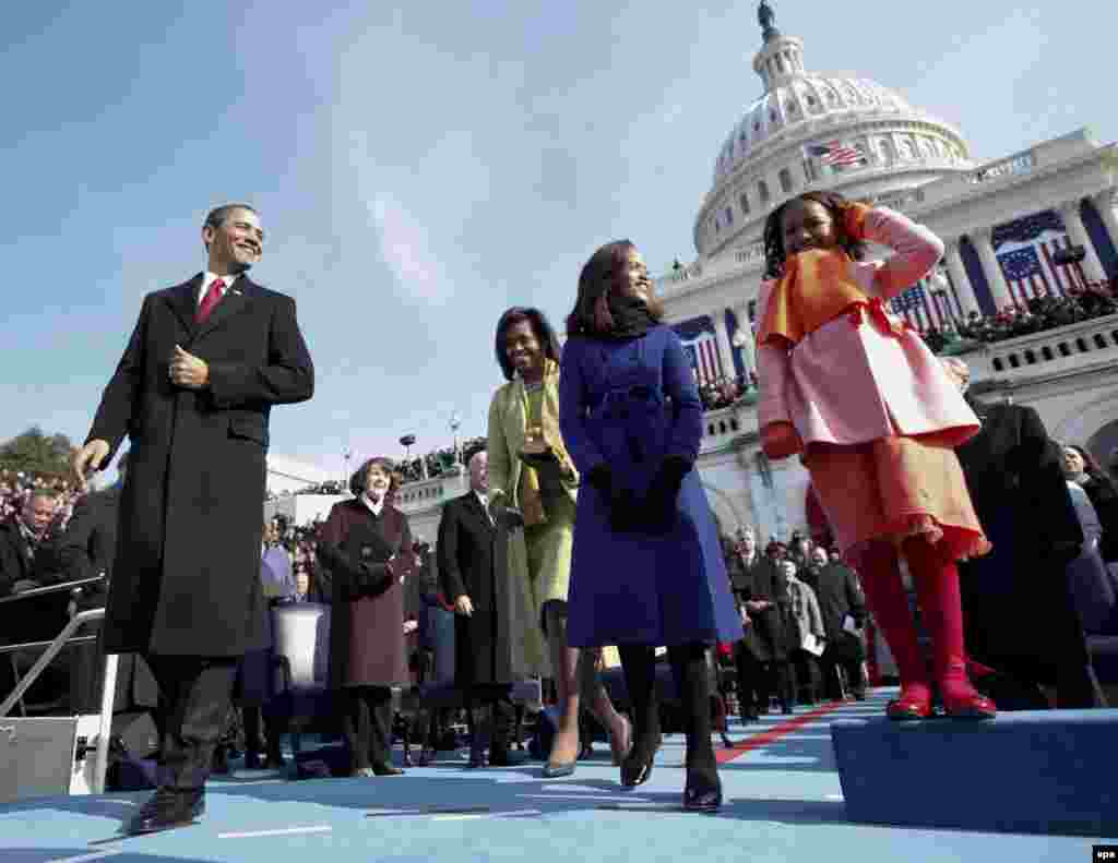 Barack Obama, joined by his wife, Michelle, and their daughters, Malia and Sasha, approaches the podium to be sworn in as the 44th president of the United States in Washington, D.C., on January 20, 2009.&nbsp;