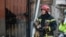 Пожежники на місці влучання російської ракети у будівлю в Києві. Район метро «Дорогожичі», 1 березня 2022 року<br>