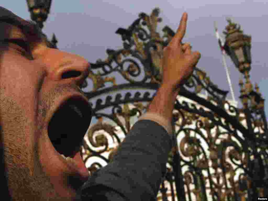 An antigovernment protester shouts anti-Mubarak slogans in front of the parliament in Cairo on February 8.