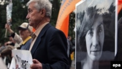 Demonstrators hold portraits of Natalya Estemirova during a rally in Moscow last year.