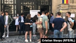 Moldovans prepare to vote at a location in neighboring Romania.