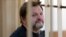 Nikita Belykh, shown here in a Moscow courtroom on February 1, pleaded not guilty and called the charges "absurd."