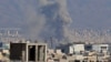 Smoke rises from the site of air strikes in a central area of the Iranian capital, Tehran, on March 6.