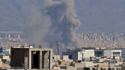 Smoke rises from the site of air strikes in a central area of the Iranian capital, Tehran, on March 6.